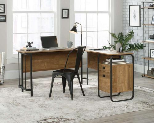 The Teknik Office Stationmaster L-Shaped Desk is an ideal option for those that need the full office solution for their home office without taking up all the room! This fresh and modern styled desk benefits from a large desktop working surface finished in a stunning contrasting Etched Oak Accent effect which not only provides more than ample space for writing and computer work, it is an ideal match for all decorative interiors. There is a small storage drawer featuring metal runners with safety stops and an additional filing drawer for letter sized hanging files. There is also a grommet hole for discreet cable management. The look is completed with a beautifully finished textured powder coated metal frame, ensuring durability and life on the desk. This desk also benefits from a 360 degree finish, for effortless and versatile placement anywhere within your home or office working area.
