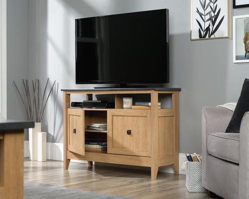 The Teknik Office Home Study TV Stand/Sideboard in a Dover Oak effect finish is a delightfully neutral coloured option for all styles of office and colour schemes.  The TV Stand offers a spacious slate finish accented top which can accommodate up to a 50 TV and weighing a maximum of 22.5kg. It has adjustable shelving behind double doors which offers flexible storage options for your electrical accessories. There is also an enclosed back with 'pass-through' openings for discreet cable management. This product will blend effortlessly within your home due to the neutral style, perfect for versatile placement in any room.
