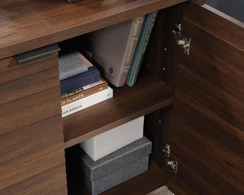 12781TK | The Teknik Office Elstree Storage Cabinet is an ideal option for those that need a stylish office solution for their home office.  With its louvre-style detailing and finished in a stunning spiced mahogany effect, you can be sure of an ideal match for all decorative interior and tastes. It has hidden storage behind doors and a large adjustable shelf for flexible storage options and a generous top surface for additional display for your file tray, favourite plant or books. It also has a 360 degree finish, for effortless and versatile placement anywhere within your home or office working area. You can up your storage points by also adding the matching 5426910 Elstree Hutch with Drawer (sold separately)