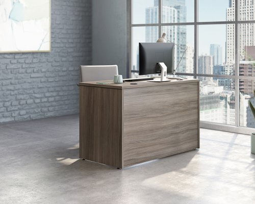 The Teknik Office Affiliate 1200 x 600 Desk is our functional and commercial style option for all manner of colour schemes and work spaces.  This compact desk offers a very durable 1” thick melamine heat, stain and scratch resistant top to hold up your laptop, favourite beverage and display items with ease. It comes with two handy grommet holes for easy cord management and the adjustable base feet will ensure it stays perfectly level on even the most uneven floors.  Beautifully finished in a Hudson Elm effect, this Desk also benefits from a 360 degree finish for adaptable placement within your office. It can be used as a stand alone desk or can be fastened to the left or right side of these Affiliate desking codes: to  5427422, 5427427, 5427415, 5427424, 5427468 and 5427428 to extend your work area. There are also other matching cupboards, desks, hutches and bookcases within the Affiliate range which will complement this item.