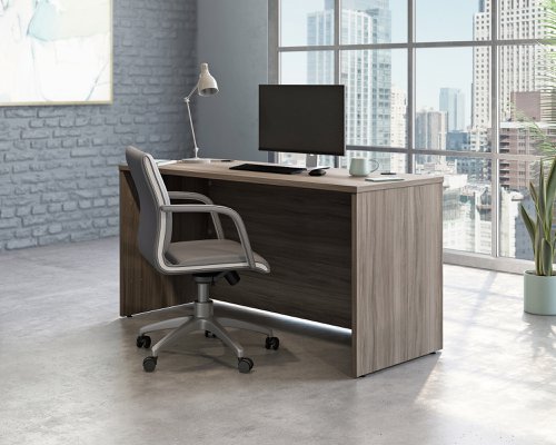 The Teknik Office Affiliate 1500 x 600 Desk is our functional and commercial style option for all manner of colour schemes and work spaces.  This desk offers a very durable 1” thick melamine heat, stain and scratch resistant top to hold up your laptop, favourite beverage and display items with ease. It comes with two handy grommet holes for easy cord management and the adjustable base feet will ensure it stays perfectly level on even the most uneven floors.  Beautifully finished in a Hudson Elm effect, this Desk also benefits from a 360 degree finish for adaptable placement within your office. It can be used as a stand alone desk or can be fastened to the left or right side of these Affiliate desking codes: to 5427413, 5427414 and 5427422 to extend your work area. There are also other matching cupboards, desks, hutches and bookcases within the Affiliate range which will complement this item.