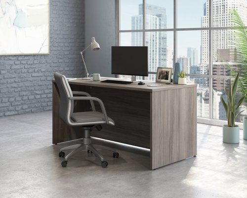 Teknik Office Affiliate 1500750 Desk in a Hudson Elm effect finish two grommet holes for cord management