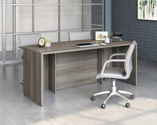 The Teknik Office Affiliate 1800 x 900 Bow Front Desk is our functional and commercial style option for all manner of colour schemes and work spaces.  This large attractively curved desk offers a very durable 1” thick melamine heat, stain and scratch resistant top to hold up your laptop, favourite beverage and display items with ease. It comes with two handy grommet holes for easy cord management and the adjustable base feet will ensure it stays perfectly level on even the most uneven floors.   The desk is also impact resistant with its high grade thermoplastic edges. Beautifully finished in a Hudson Elm effect, this Desk also benefits from a 360 degree finish for adaptable placement within your office. There are also other matching cupboards, desks, hutches and bookcases within the Affiliate range which will complement this item.