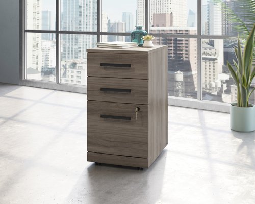 Teknik Office Affiliate 3 Drawer Mobile Pedestal in a Hudson Elm effect finish, two small drawers, one larger spacious filer lockable drawer