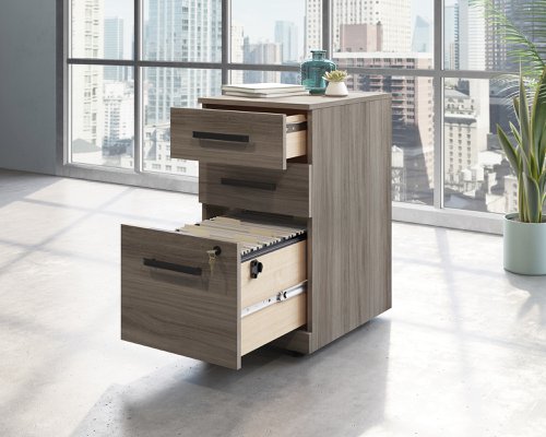 Teknik Office Affiliate 3 Drawer Mobile Pedestal in a Hudson Elm effect finish, two small drawers, one larger spacious filer lockable drawer