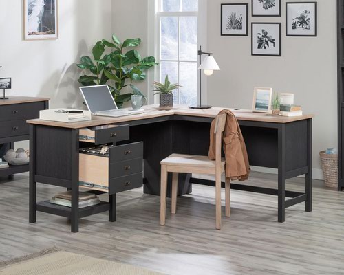 12725TK | The Teknik Office Shaker Style L Shaped Desk in a Raven Oak effect finish is a simple and clean looking style option, a perfect offering for the home office or study. The contrasting Lintel Oak coloured accent desktop and return adds to the general look.  This desk has two drawers with full extension slides, a letter sized filing drawer  and an additional lower shelf for storing all manner of office accessories. The grand desktop provides a versatile and ample space for coursework, laptops, homework and study and comes with easy cord management to keep those wires at bay. It also has the added benefit of being finished throughout so you can place the desk freestanding in any location and at any angle.
