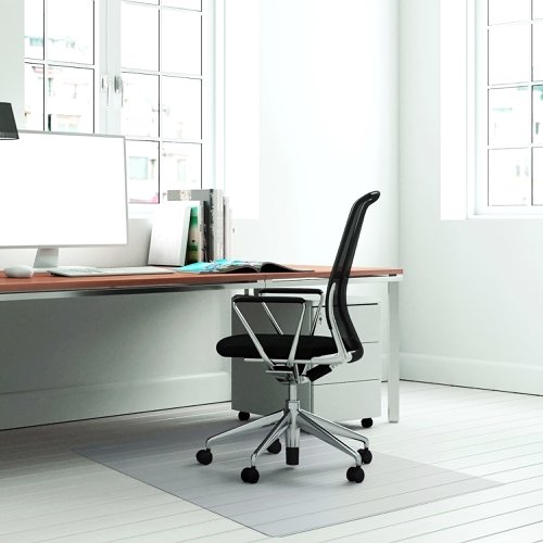 8800004 | The Teknik Office APET Chair Mat for Hard Floors is a high-quality, sustainable product which provides a durable and protective barrier for your carpeted work area. Measuring 90cm x 120cm, this smooth-backed mat provides secure placement and a rigid and ergonomic easy-glide surface for castor-based chairs, making it easy to move around the workspace. It has high impact resistance for premium performance and no cupping or sinking, ensuring that it provides extremely durable and long-lasting floor protection. The mat is also compatible with underfloor heating systems, making it suitable for use in any workspace. The high clarity of the mat allows beautiful flooring to shine through, making it an excellent choice for homes and businesses that want to showcase their flooring while still providing a protective barrier. The mat is emission-free, ensuring that it does not release any harmful chemicals or substances into the air. The APET chair and floor protection mat is 100% recyclable, making it an eco-friendly choice for those that want to reduce their environmental impact. It is manufactured in the UK, and 50% of the manufacturing site's energy is derived from renewable sources. This ensures that the product is produced sustainably and reduces the carbon footprint associated with its production. The mat comes with a 5-year limited warranty, providing users with peace of mind and ensuring that the product is of high quality and durability.