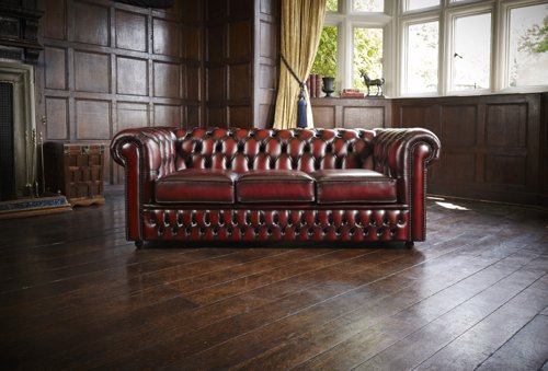 Teknik Office Chesterfield 3 seater button back leather sofa in Antique Red with scrolled arms, elegant turned legs and pigmented leather  