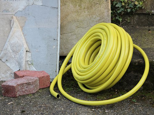 The Faithfull Builder's Hose is a superior quality hose, ideal for worksite use. It is made from heavy-duty polyester, reinforced with a 24 braid fibre mesh for extra strength, making it both strong and flexible. The tough 3-ply construction is kink, twist and crush resistant, and highly resilient to UV light, frost, algae and is easy to clean.The hose is compatible with all 12.5 to 15mm or 19mm fittings depending on the bore size selected. The hose has a working pressure of 10 bar with a temperature range of -10 to +40°C. The bright yellow colour make this hose easy to spot on the worksite.Covered by a 5-Year guarantee.Available in 2 bore sizes of 12.5mm or 19.25mm for an increased flow rate.1 x Faithfull Heavy-Duty Reinforced Builder's HoseLength: 30m Diameter: 19mm (3/4in)