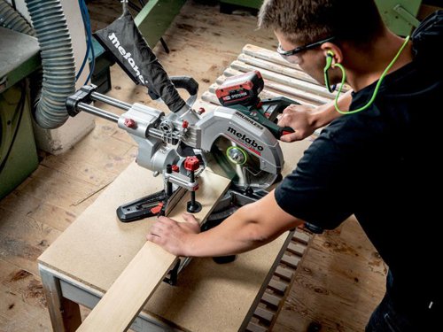 The Metabo KGS 18 LTX BL 216 Brushless Mitre Saw comes with a powerful brushless motor for sawing like a mains-powered tool. Soft start and overload protection provide a long motor and drive service life. It has a large cutting capacity thanks to the sliding function for wide work pieces.The turntable features stop points of common angles for fast, precise setting. With saw blade inclination from -2 to 47??, making it suited to undercuts. A quick-action clamp for secure fixing of the work piece from the top or front. There is also a depth guide for easy creation of grooves. Precision Cut Line (PCL) provides a precise shadow cutting line, without re-adjustment, thanks to a cleverly positioned LED. All scales and operating elements are visible from the working position and can be operated intuitively. Fitted with ergonomic handle areas for easy carrying, with one or two hands.Part of the CAS system. This product can be combined with all 18V battery packs and chargers of the CAS brands. Many brands, one battery pack system.Supplied with: 1 x Classic Cordless Cut Wood Saw Blade 254 x 30mm x Z48, 2 x Table Length Extensions, 1 x Length Guide, 1 x Material Clamp, 1 x Tool for Saw Blade Change, 1 x Chip Collection Bag, 1 x 18V 4.0Ah Li-Power Battery Pack and 1 x AIR COOLED Charger ASC 55.Specifications:No Load Speed: 4,000/min.Max. Cutting Speed: 53 m/s.Saw Blade: 254 x 30mm.Max. Cutting Width 90??/45??: 305/215mm.Max. Cutting Depth 90??/45??: 92/47mm.Cutting Capacity (mm): 90??/90?? 305 x 92, 45??/45?? 215 x 47.Turntable Setting Left/Right: 50??/50??.Saw Blade Tilt Left/Right: 47??/2??.Support Surface: 345 x 760mm.Weight: 14.8kg (without battery pack).