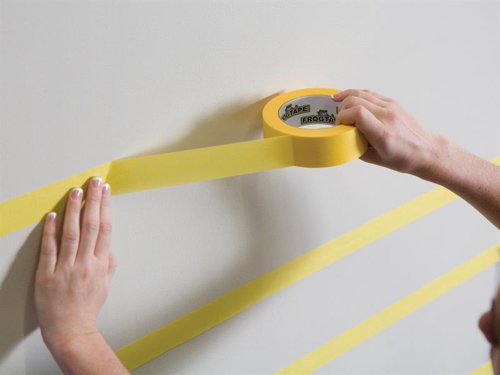 FrogTape® Delicate Surface is a low tack painter's masking tape for use on freshly painted surfaces, most coated wallpaper and newly plastered walls. Designed for use with Emulsion Paint. For best results remove FrogTape ® immediately after painting. FrogTape® Delicate Surface is UV resistant and can be applied in direct sunlight. It is ideal for creating stripes and paint effects.FrogTape® is the only painter’s masking tape treated with PaintBlock® Technology. PaintBlock® reacts with emulsion paint to form a micro-barrier that seals the tape edges. The result is the sharpest lines possible, making touch-ups a thing of the past.Keeps paint out, Keeps lines Sharp ™This FrogTape® Delicate Masking Tape has the following specification:Width: 24mmLength: 41.1mSupplied in a box.