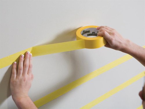 FrogTape® Delicate Surface is a low tack painter's masking tape for use on freshly painted surfaces, most coated wallpaper and newly plastered walls. Designed for use with Emulsion Paint. For best results remove FrogTape ® immediately after painting. FrogTape® Delicate Surface is UV resistant and can be applied in direct sunlight. It is ideal for creating stripes and paint effects.FrogTape® is the only painter’s masking tape treated with PaintBlock® Technology. PaintBlock® reacts with emulsion paint to form a micro-barrier that seals the tape edges. The result is the sharpest lines possible, making touch-ups a thing of the past.Keeps paint out, Keeps lines Sharp ™This FrogTape® Delicate Masking Tape has the following specification:Width: 36mmLength: 41.1mSupplied in a box.