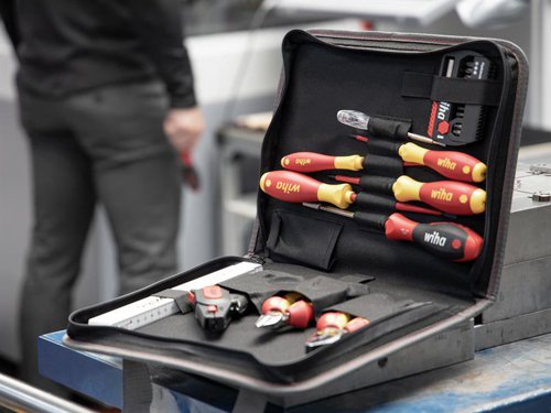 The 32 Piece Wiha electrician Tool Set contains a selection of tools that cover the most common applications for electricians. All the VDE tools in this kit have been individually tested at 10,000 V AC for electrical safety in accordance with IEC 60900:2012. Approved for 1,000 V AC.Supplied in a folding tool bag, features a zip, carrying handle and pockets for hand tools. Provides plenty of storage space and an orderly arrangement.Contains the following:2 x electric SoftFinish® Slotted Screwdrivers: 3.5 x 100mm & 5.5 x 125mm.2 x electric SoftFinish® Phillips Screwdrivers: PH1 x 80mm & PH2 x 100mm.1 x Professional electric Diagonal Cutters with DynamicJoint® 160mm.1 x SoftFinish®Bit Magazine Screwdriver with 8 x 25mm Bits (SL6.5mm, PH1, PH2, PH3, PZ2, T15, T20 & T25).1 x FlipSelector T-Bit Set, 13 Piece (12 x 25mm Bits: PH2(x2), PZ1, PZ2(x2), PZ3, T10, T15, T20, T25, T30 & T40 and 1 x Magnetic Bit Holder 58mm).1 x Professional electric Combination Pliers with DynamicJoint® 180mm.1 x Automatic Stripping Tool (up to 6mm²).1 x SoftFinish® Single-pole Voltage Tester.1 x Longlife® Electrician's Folding Ruler 2m.