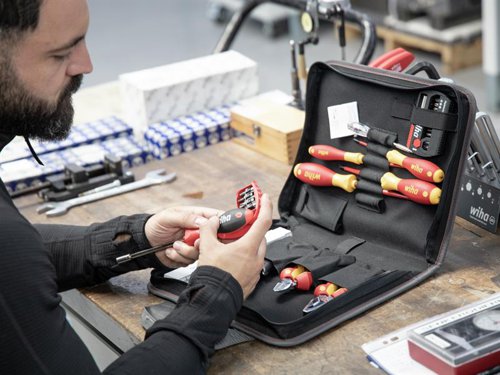 The 32 Piece Wiha electrician Tool Set contains a selection of tools that cover the most common applications for electricians. All the VDE tools in this kit have been individually tested at 10,000 V AC for electrical safety in accordance with IEC 60900:2012. Approved for 1,000 V AC.Supplied in a folding tool bag, features a zip, carrying handle and pockets for hand tools. Provides plenty of storage space and an orderly arrangement.Contains the following:2 x electric SoftFinish® Slotted Screwdrivers: 3.5 x 100mm & 5.5 x 125mm.2 x electric SoftFinish® Phillips Screwdrivers: PH1 x 80mm & PH2 x 100mm.1 x Professional electric Diagonal Cutters with DynamicJoint® 160mm.1 x SoftFinish®Bit Magazine Screwdriver with 8 x 25mm Bits (SL6.5mm, PH1, PH2, PH3, PZ2, T15, T20 & T25).1 x FlipSelector T-Bit Set, 13 Piece (12 x 25mm Bits: PH2(x2), PZ1, PZ2(x2), PZ3, T10, T15, T20, T25, T30 & T40 and 1 x Magnetic Bit Holder 58mm).1 x Professional electric Combination Pliers with DynamicJoint® 180mm.1 x Automatic Stripping Tool (up to 6mm²).1 x SoftFinish® Single-pole Voltage Tester.1 x Longlife® Electrician's Folding Ruler 2m.