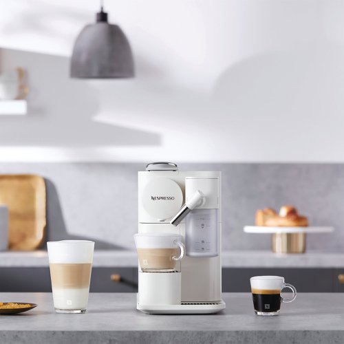 The Nespresso single serve, coffee machine features three beverage buttons to easily select your favourite drink, whether that be an Espresso or one of the coffee recipes using the removable milk jug. Simple to use with the 'One touch' system, this compact coffee machine is easy to clean with a dishwasher safe, removable water tank and milk jug. Enjoy premium coffee in the comfort of your own home with the Lattissima Nespresso coffee machine. Supplied in white with an Energy A++ rating.