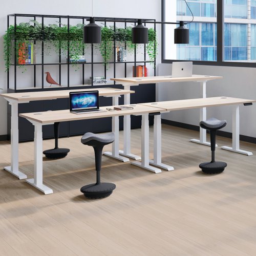 This Jemini Sit/Stand Desk features 3 stage height adjustability with a digital display and 4 pre-set buttons for an easy transition between sitting and standing. The 25mm thick desktop is mounted on sturdy cantilever legs and features dual cable management ports. This desk measures 1200x800x630-1290mm and comes with white legs.