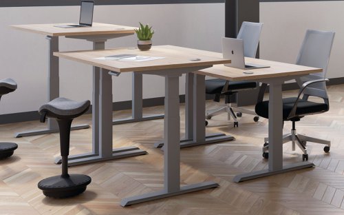 This Jemini Sit/Stand Desk features 3 stage height adjustability with a digital display and 4 pre-set buttons for an easy transition between sitting and standing. The 25mm thick desktop is mounted on sturdy cantilever legs and features dual cable management ports. This desk measures 1400x800x630-1290mm and comes with white legs.