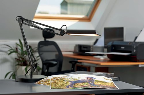 The Unilux Swingo desk lamp for home or office use features a spring balanced, double articulated arm to customise the lighting while ensuring the lampshade stays parallel to the working surface. Made from ABS painted steel, the Swingo design is equipped with a dimmer switch for three adjustable lighting intensities. Supplied in black, the lamp can be positioned with either the standard base or the clamp, offering extra flexibility of placement.