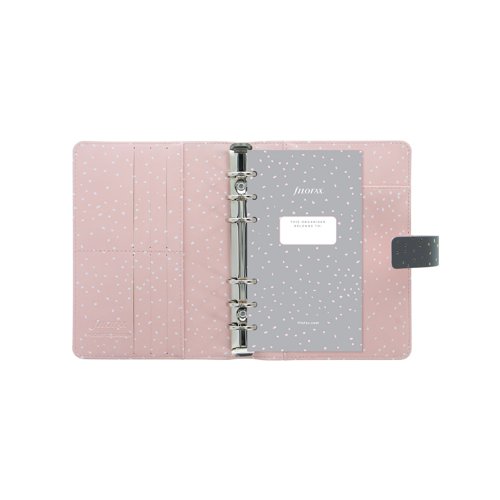 Enjoy everyday planning with this Personal size organiser from the Filofax Confetti Collection, with a Charcoal, smooth faux-look cover with gold foil accents and rose pink colour patterned interior. With a 23mm ring capacity, and a closure strap to ensure contents are protected and remain private. Supplied with a transparent flyleaf, front sheet, week to view diary with appointment times, six tab index, four sheets of to do lists, eight sheets of white ruled notepaper, four sheets of white quadrille notepaper, eight sheets of white plain notepaper, eight sheets of contacts, eight sheets of blue ruled notepaper, eight sheets of green ruled notepaper, eight sheets of pink ruled notepaper, ruler/ page marker, top opening envelope.