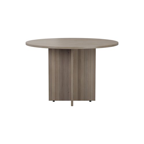 This beautifully constructed grey oak veneer table with round table top is suitable for the office and the home, and makes a great, informal meeting area. A cruciform base provides stability for long lasting, extended use. In addition, an easy to clean surface allows you to clean up after use with consummate ease. The diameter of the table is 1100mm and it is 730mm high.
