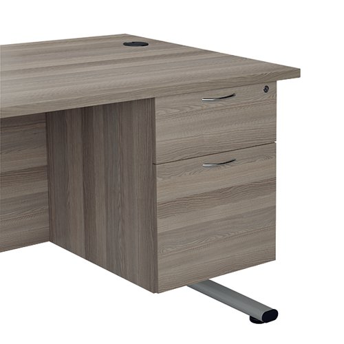 Finished in Grey Oak, the Jemini fixed pedestal features 2 drawers including 1 box drawer and 1 foolscap size filing drawer. The box drawer will take A4 files. Measuring W400 x D500 x H495mm with a 25mm desktop, this Jemini fixed pedestal is designed for use with single upright desks, making an ideal storage solution.