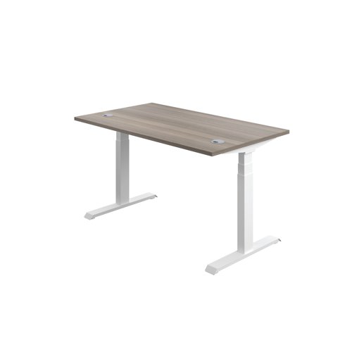 This Jemini Sit/Stand Desk features 3 stage height adjustability with a digital display and 4 pre-set buttons for an easy transition between sitting and standing. The 25mm thick desktop is mounted on sturdy cantilever legs and features dual cable management ports. This desk measures 1200x800x630-1290mm and comes with white legs.